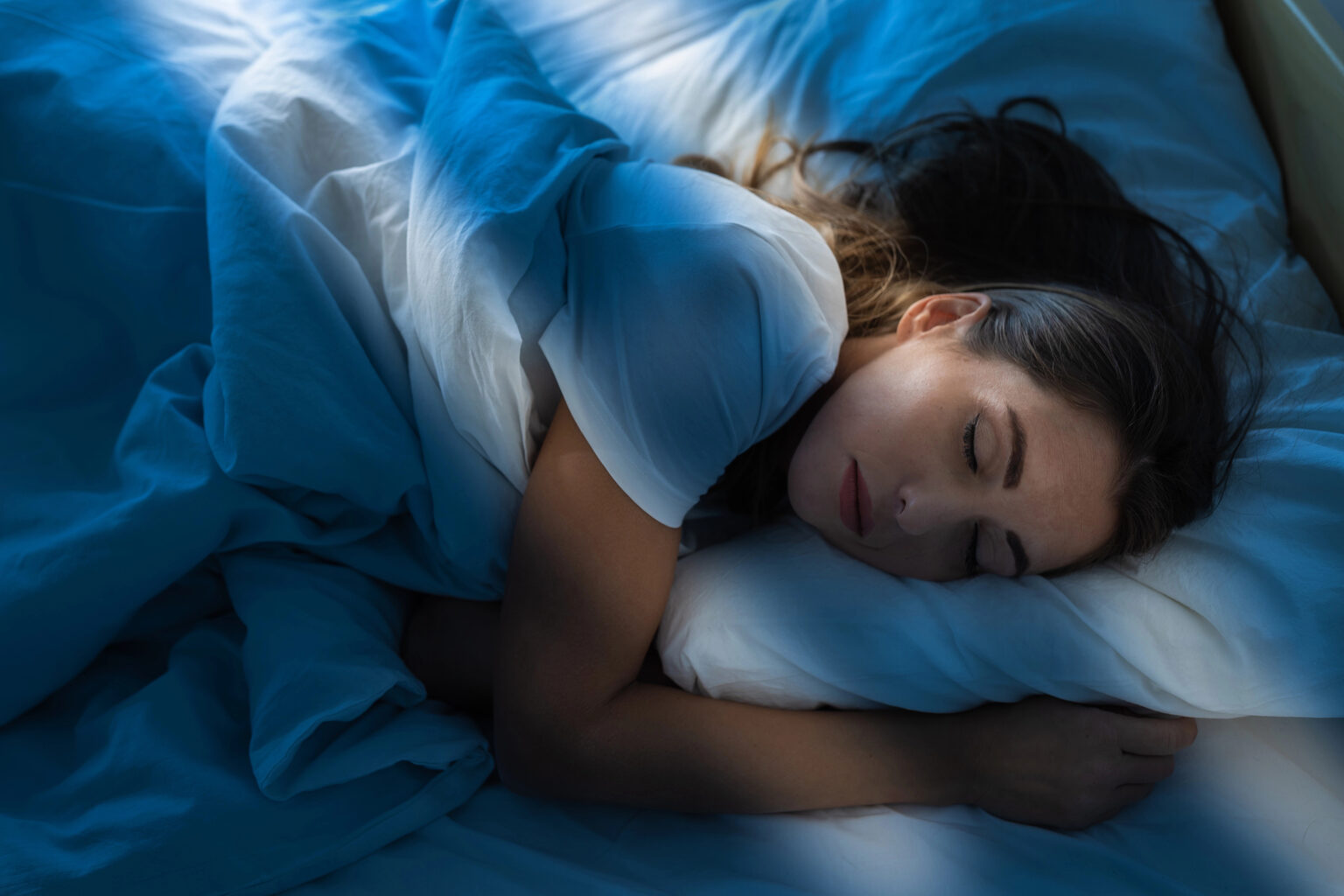 Woman sleeping peacefully at night