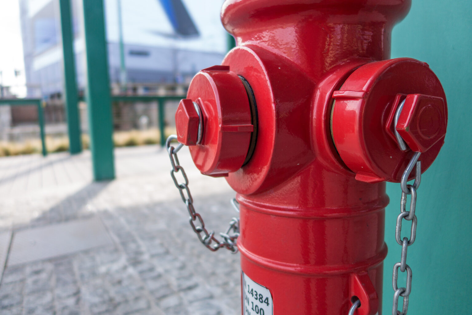 Red fire hydrant on a city sidewalk